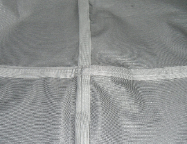Garment seam sealing on stitches