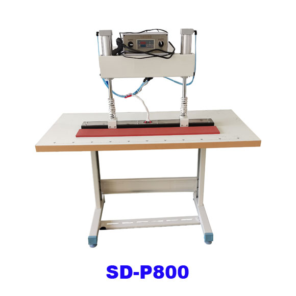 Heat pressing machine for reflective tape attachment